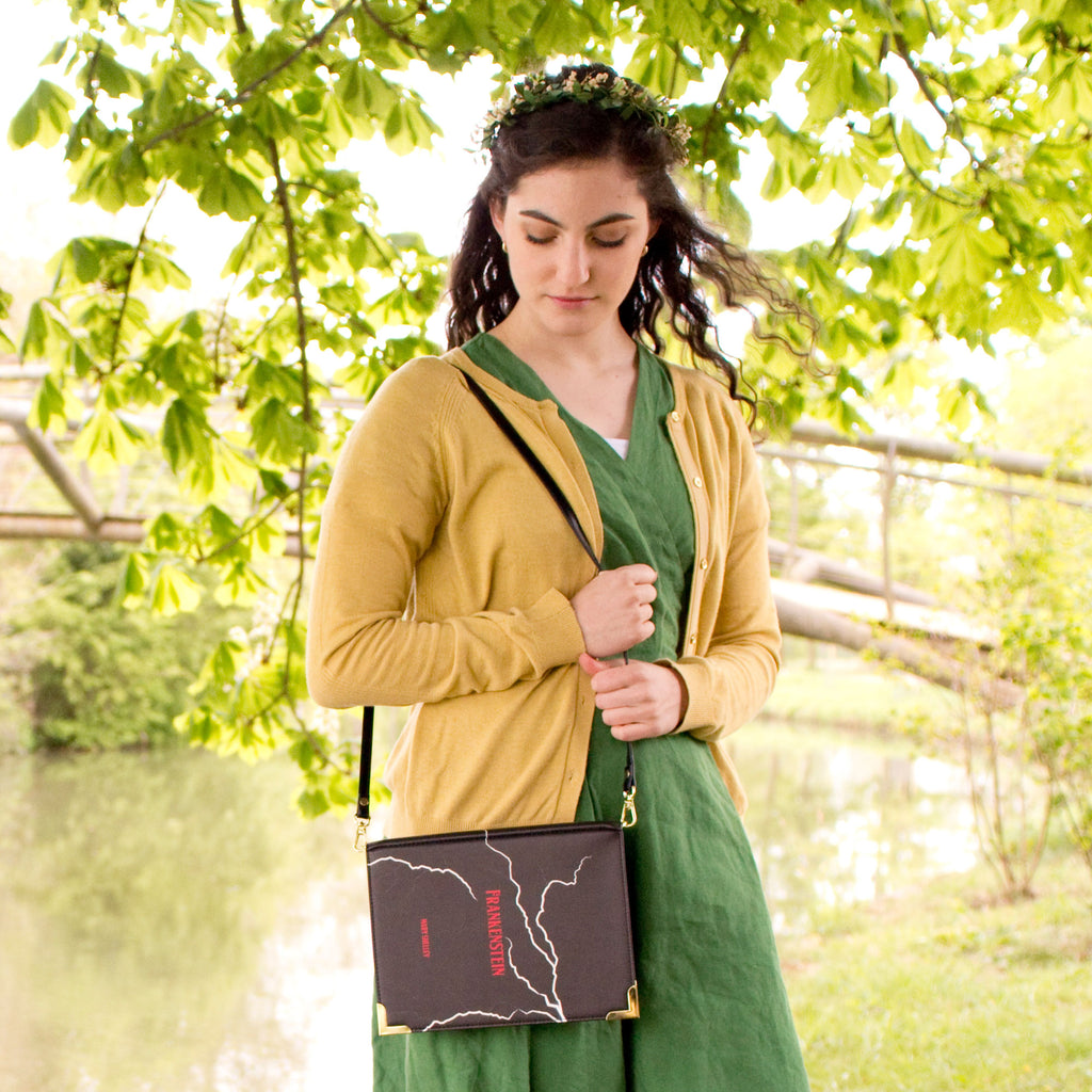 Frankenstein Black Handbag by Mary Shelley featuring White Lightning Strikes design, by Well Read Co. - Model Standing