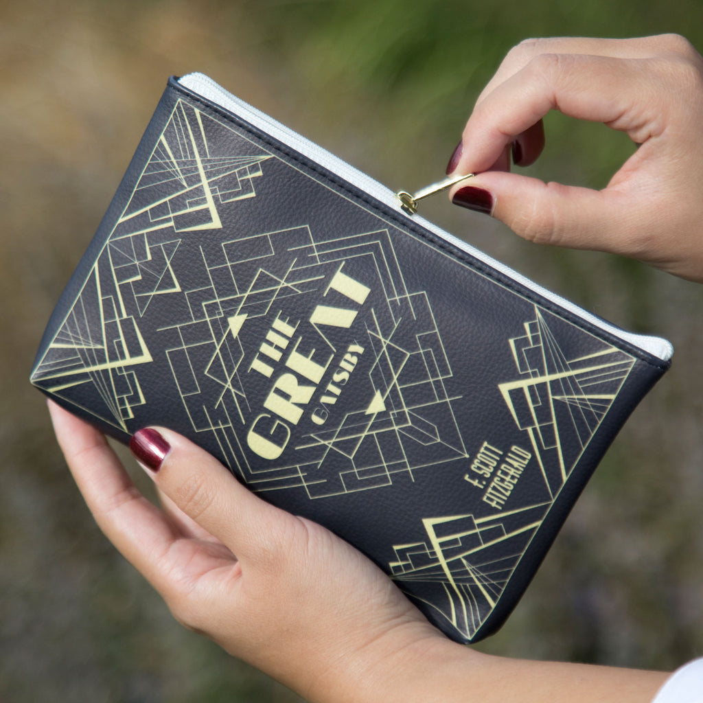 The Great Gatsby Black and Gold Pouch Purse by F. Scott Fitzgerald featuring Art Deco Lattice design, by Well Read Co. - Hand on the zipper