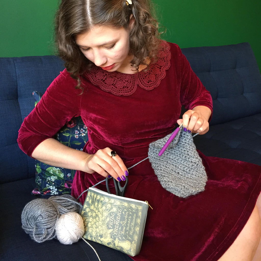 Pride and Prejudice Green Pouch Purse by Jane Austen with Gold Peacock design, by Well Read Co. - Model Sitting