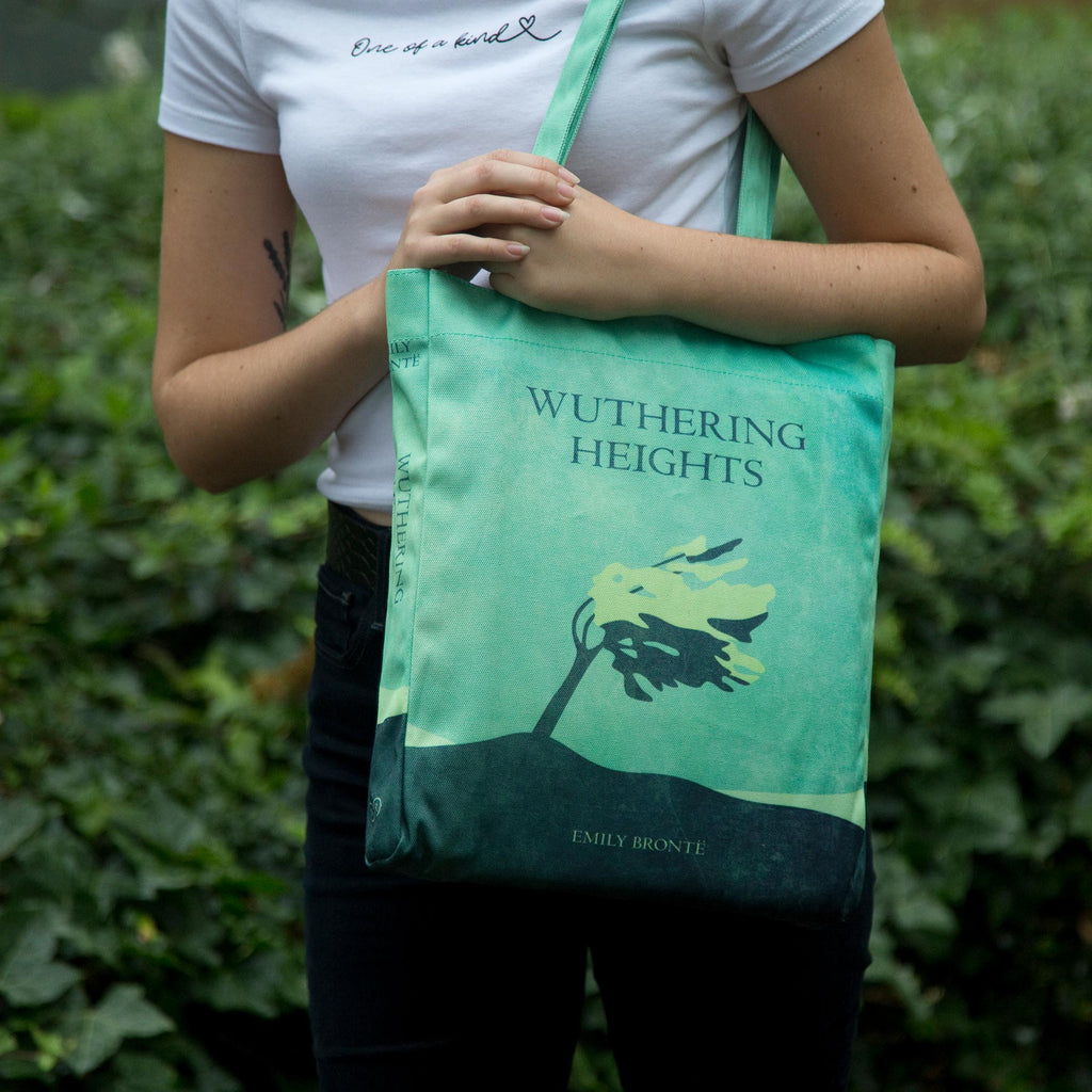 Wuthering Heights Green Tote Bag by Emily Brontȅ featuring Lone Tree design, by Well Read Co. - Model with bag